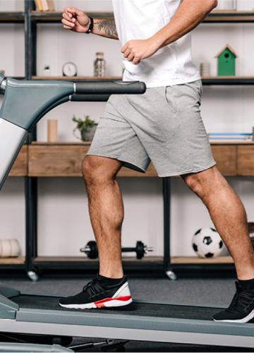 man running on treadmill